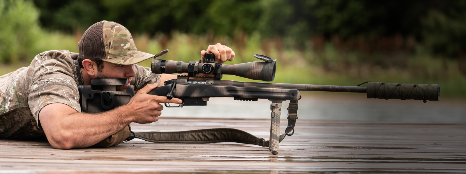 Man shooting a rifle.